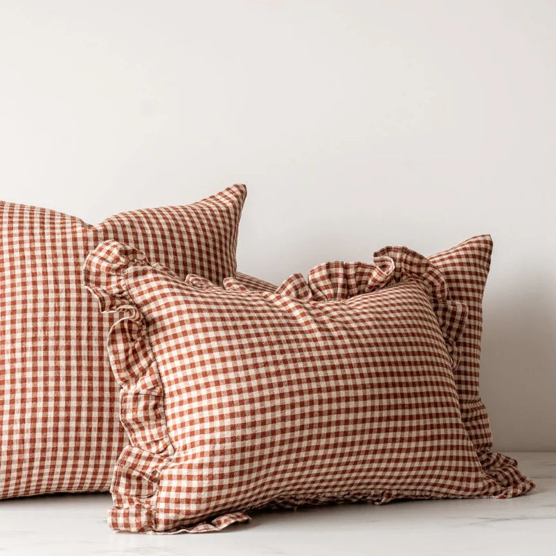 Ruffle pillow cover in a gingham linen material and adds a nice cozy touch to each space.
